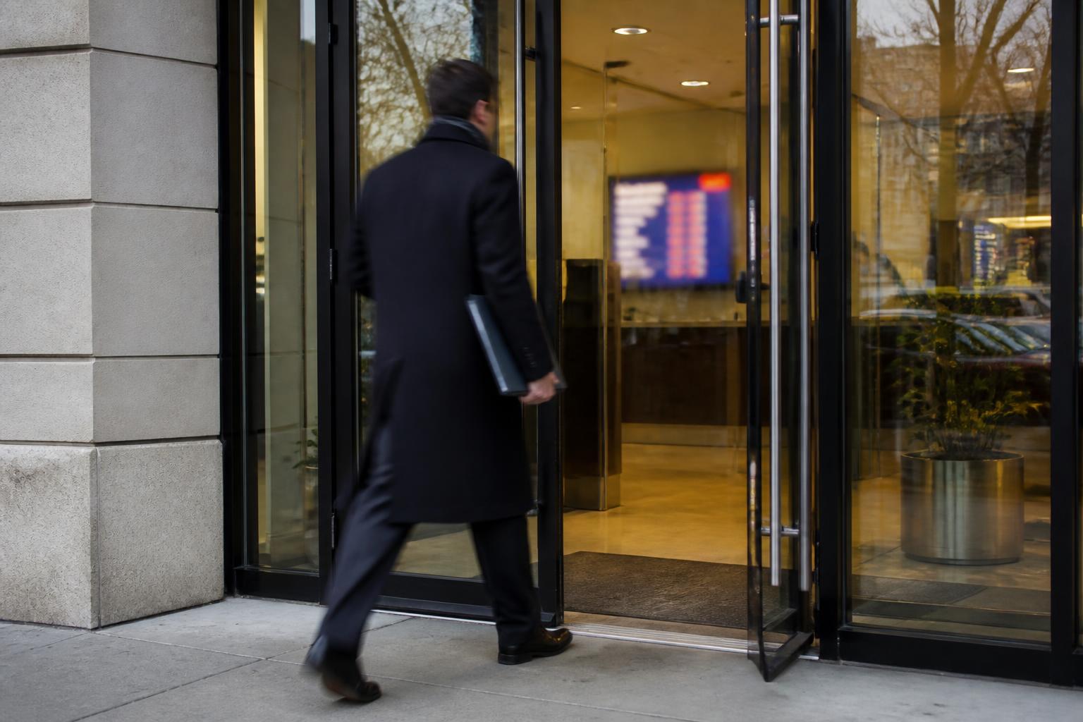 A borrower entering a generic bank during March rate uncertainty.