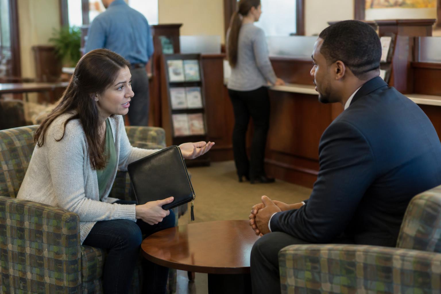 A customer asking a banker about credit-file protections.